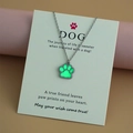 Glow-in-the-dark paw pendant with stainless steel chain on a gift message card - Green