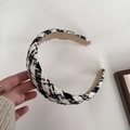 Detailed view of black and white houndstooth fabric headband with a soft inner lining - Black & White Large Plaid
