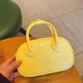 Mini yellow PVC jelly bag with shiny candy color finish and trendy top handles - Yellow