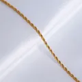 Elegant gold-tone rope chain necklace on white silk background featuring twisted metal texture - Rope Chain 40+5cm-Gold