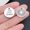 Detail of silver alloy inspirational charms featuring live your dream and sunburst engraving - Round Liveyourdream Letter Tag (2491)