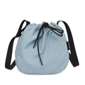 Light blue nylon drawstring bucket bag with adjustable shoulder strap and logo tag - Blue