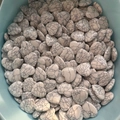 Polished heart-shaped white howlite stones with black veined patterns in a container - Black Line White Turquoise