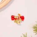Close-up of red Christmas bow hair clip with golden holly leaves and small bells - Red with Gold Leaves