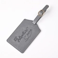 Gray faux leather luggage tag featuring engraved adventure quote and secure strap - Gray