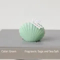 Sage and sea salt scented mint green shell candle measuring 6cm by 4.5cm - Green