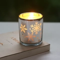 Silver plated glass candle holder with snowflake pattern and warm glowing flame - Silver Small Snowflake