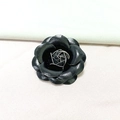 Elegant black faux leather camellia flower brooch with gold wire metal core detail - Black