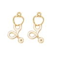 Golden stethoscope charms with white enamel for DIY medical themed jewelry making - Stethoscope