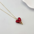 Elegant gold chain necklace with a vibrant red heart pendant for a vintage look - Red