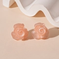 Detail view of pink resin rose petal earrings with elegant pearlescent finish - Peach Pink Rose
