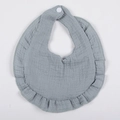 Macro detail of breathable double-layer gray gauze cotton baby bib with ruffle edges - Bean Green