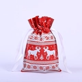 Red Christmas drawstring gift bag with white reindeer pattern and metallic foil finish - 23x16cm White Reindeer