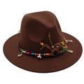Detail of brown fedora hat with bohemian beaded band, tassels and natural shells - Coffee