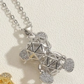 Macro shot of silver hollow bear pendant necklace with sparkling zircon pave details - Silver / White Zirconia