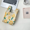 Chic knit handbag featuring yellow sunflower patterns on off-white textured fabric - Yellow Daisy