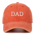 Detail of white DAD embroidery on washed orange cotton baseball cap with vintage finish - DAD Embroidery / Orange