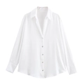 Detailed close-up of white silk satin long sleeve shirt with premium button cuffs - White