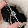 Close-up of sparkling blue zircon tennis bracelet with adjustable bead clasp on wrist - 33# Silver Blue Main Stone Style