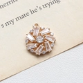 Macro shot of a golden sunburst pendant with radiant rectangular cubic zirconia stones - 9# Circular Radial