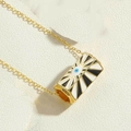 Detailed macro view of gold evil eye cylinder pendant with blue enamel and striped texture - Black Pendant (XL2685-8)