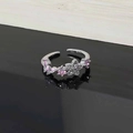 Detailed macro view of pink zircon flower and butterfly motif on silver adjustable ring - Style 6 Butterfly Star Pink Zirconia Ring