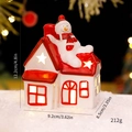Ceramic Christmas house with snowman topper, warm LED glow, red and white festive decor - Snowman on Roof