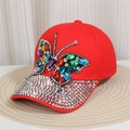 Detail of red denim baseball cap featuring a vibrant rhinestone butterfly and studded brim - Style 32-Red Full Rhinestone Butterfly