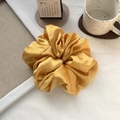 Detail view of large golden satin hair scrunchie with silk-like texture on linen cloth - 9#Gold