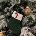 Green knitted Christmas stocking with white cuff featuring a red letter I embroidery - Green/Letter I