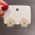 Macro detail of elegant five-petal flower earrings with pearlescent finish and gold frame - No.8 Pearlescent White 5-Petal Flower (C9A12)