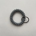 Dark grey spiral coil keychain with metallic ring for DIY wristband and key storage - Gray