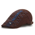 Detail of dark brown newsboy hat with blue quilting and embroidered CUB WHITE CDEBT logo - M Label Patchwork Style / Coffee