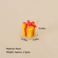 Miniature yellow resin Christmas gift box figurine with a red bow and glossy finish - No.45 - Resin Yellow Gift Box Ornament