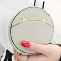 Mini round coin purse in sage green featuring golden cat ears and a metallic chain - Gray