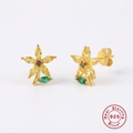 Macro shot of 925 sterling silver flower earrings with yellow and green crystals - Yellow Petal
