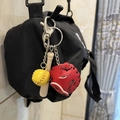 Three-piece baseball keychain with yellow ball, wooden bat, and red glove on black bag - 2CM Yellow Ball Long Bat Red/Black