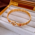 Close-up of vintage gold hollow bracelet with white pearls and red gemstones - Gold Red Hollow Pearl (WB1582)