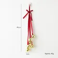 Decorazione natalizia con fiocco di velluto rosso e sei campanellini d'oro a stella - Scacciapensieri Rosso Stile A (46g)