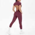 Macro view of burgundy short sleeve bodysuit featuring an open back and ruched butt lift - Burgundy