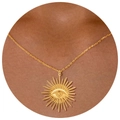 Gold evil eye sunburst pendant necklace on model with thin round link chain - Evil Eye Necklace