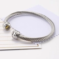Silver steel cable open bangle featuring round yellow zircon stones at each end - November/Yellow