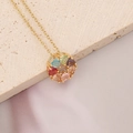 Detailed close-up of rainbow heart-shaped zirconia stones set in a gold circle pendant - Circular Heart Style (9#)