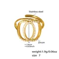 Especificaciones del anillo de doble círculo en acero y circón con dimensiones y peso detallado - US 7 / Dorado