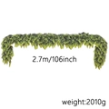 Detail of 2.7m realistic green Norfolk pine garland showing 106 inch length and weight - 2.7m 238 Tips 2010g