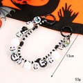 Halloween skull beaded keychain with black and white acrylic charms and letter beads - Double Chain Skull Beaded Strap Black White Beads
