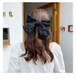 Elegant black lace hair clip with a large bow and long streamers on a female model - 2-Layer Large Black Lace Spring Clip