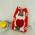 Close-up of knit tote bag with red heart pattern and soft fabric texture detail - Tulip Orange Red