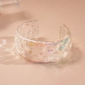 Detail of holographic acrylic cuff bracelet with hammered water ripple texture - Pleats