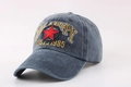 Detail view of washed cotton baseball cap with red star patch and HILARITY embroidery - Navy Blue